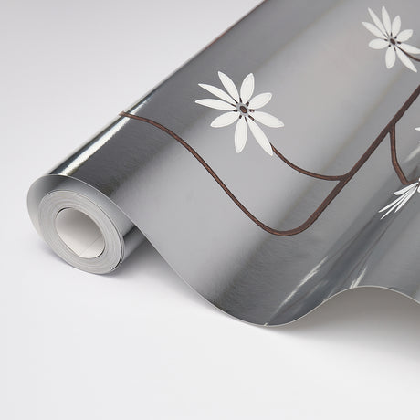 Hollywood Grape wallpaper in Aluminum by Neisha Crosland for Schumacher, featuring a geometric flowering fruit vine on a metallic ground.