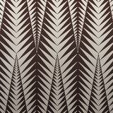 Zebra wallpaper in brown and silver by Neisha Crosland for Schumacher, featuring a bold abstract animal-inspired geometric pattern.