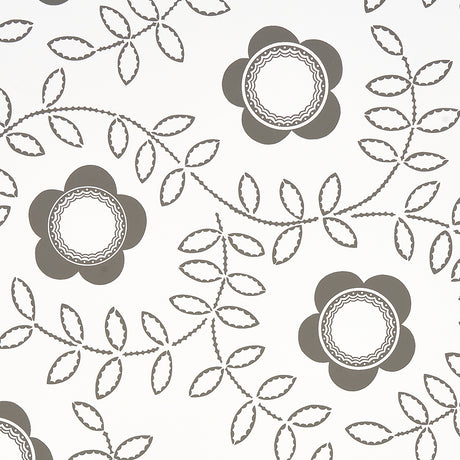 TUDOR ROSE wallpaper in charcoal and white by Schumacher, featuring a bold floral and leaf pattern designed by Neisha Crosland.