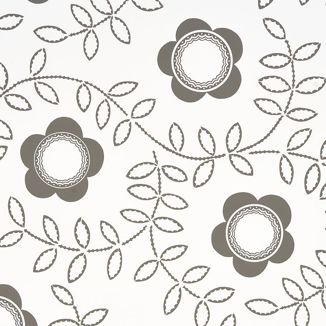 TUDOR ROSE wallpaper in charcoal and white by Schumacher, featuring a bold floral and leaf pattern designed by Neisha Crosland.