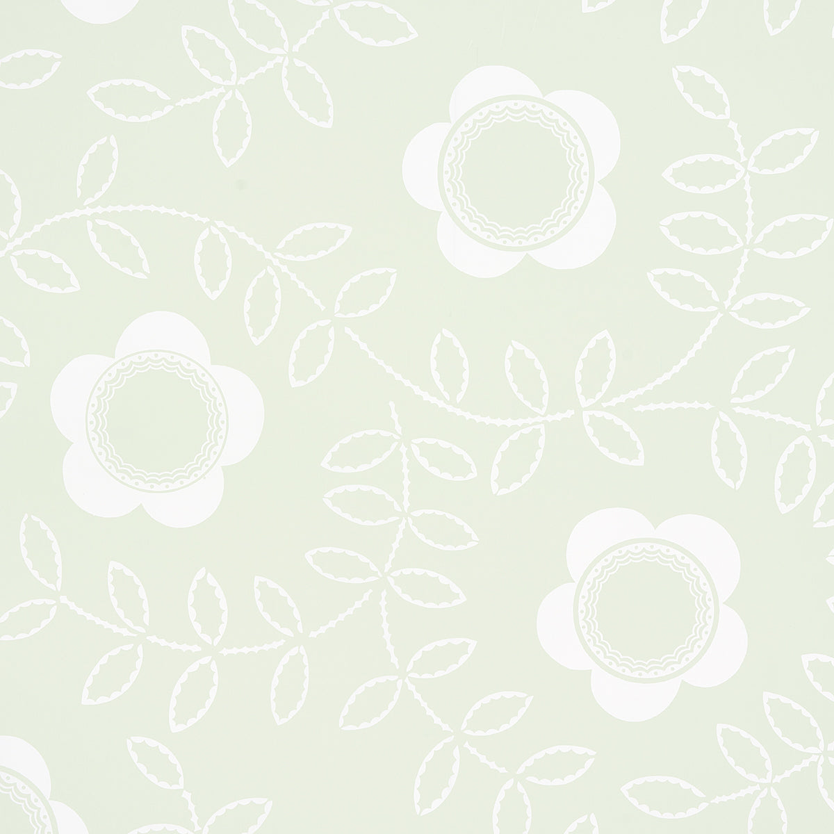 TUDOR ROSE wallpaper in Pistachio by Schumacher, featuring a large-scale floral pattern in white on a soft green background, styled in a bedroom setting.