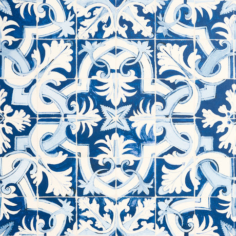 Azulejos wallpaper in azure blue by Mary McDonald for Schumacher, inspired by antique Portuguese tiles with an intricate interlocking pattern.