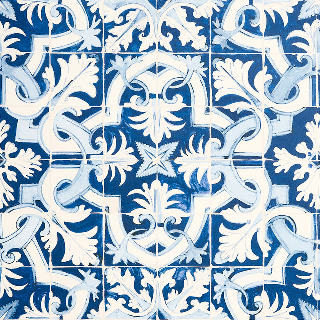 Azulejos wallpaper in azure blue by Mary McDonald for Schumacher, inspired by antique Portuguese tiles with an intricate interlocking pattern.
