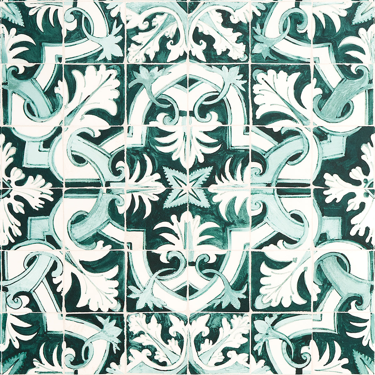 Azulejos wallpaper in Emerald by Mary McDonald for Schumacher, inspired by antique Portuguese tiles, featuring an intricate green and white interlocking pattern.