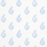 Kerala Paisley II blue paisley wallpaper by Schumacher shown in a bathroom and bedroom interior, classic handblock print style.