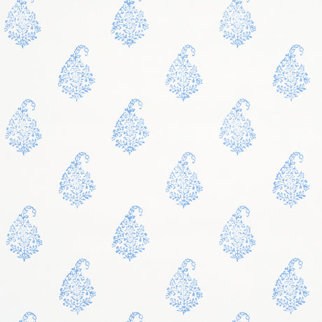 Kerala Paisley II blue paisley wallpaper by Schumacher shown in a bathroom and bedroom interior, classic handblock print style.