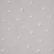 Heavenly Bodies wallpaper in gray by Schumacher, featuring abstract star and cloud motifs on a soft background.