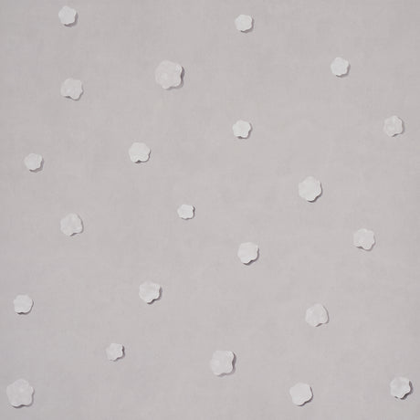Heavenly Bodies wallpaper in gray by Schumacher, featuring abstract star and cloud motifs on a soft background.