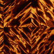 Tortoise Shell wallpaper by Schumacher in a natural brown faux tortoise pattern, designed by Celerie Kemble, shown as a roll and installed in an entryway.