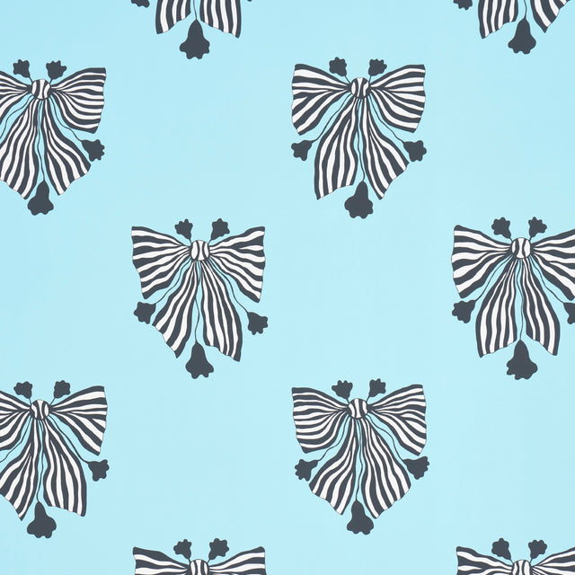 Bow-Wow-Wow wallpaper in Aqua by Schumacher, featuring bold black and white bow motifs on a light blue background.
