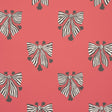 Bow-Wow-Wow wallpaper in red by Schumacher, featuring bold black and white striped bows on a vibrant red background.