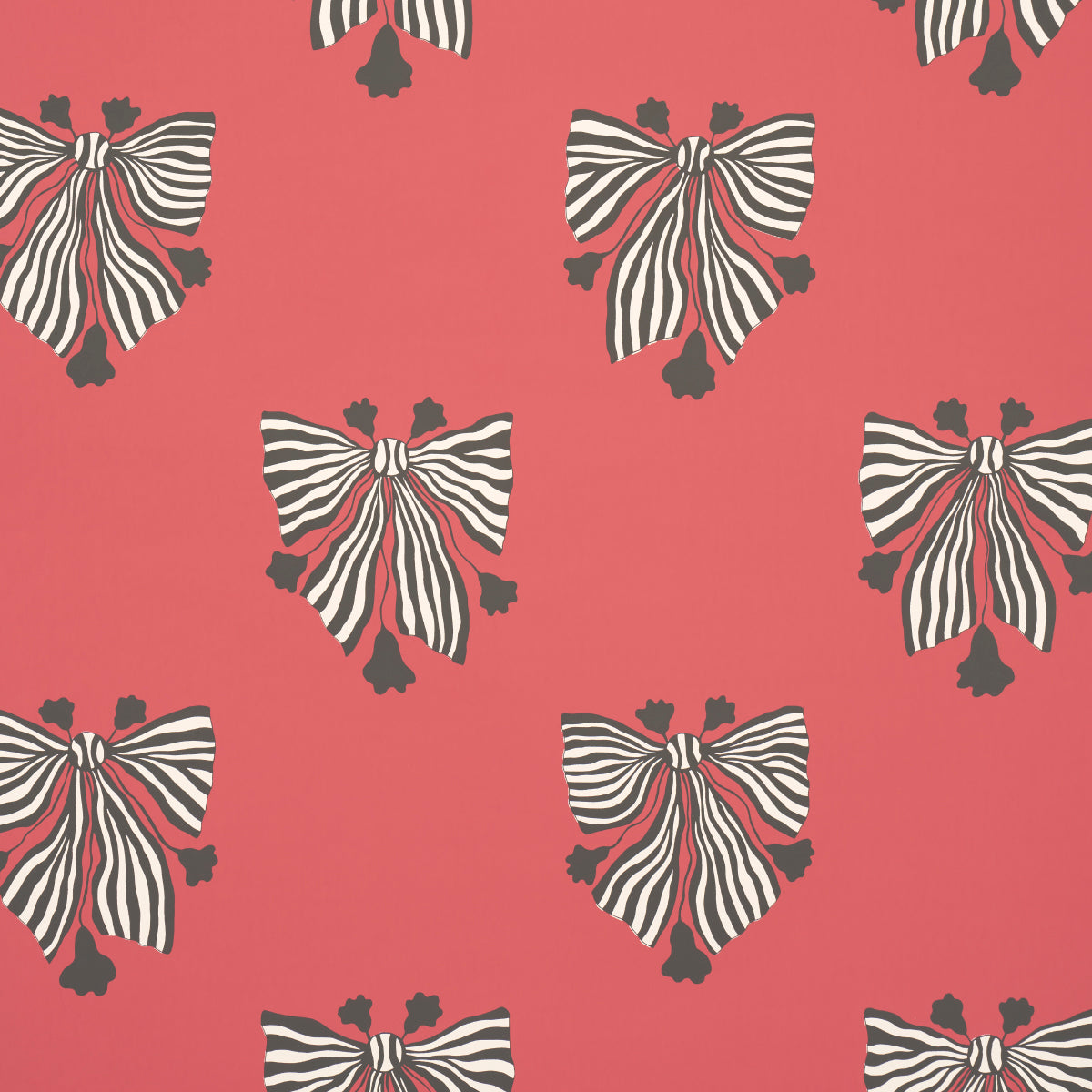 Bow-Wow-Wow wallpaper in red by Schumacher, featuring bold black and white striped bows on a vibrant red background.