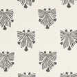 Bow-Wow-Wow wallpaper in cream by Schumacher, featuring whimsical black and white bow motifs on a cream background, styled in a modern interior.