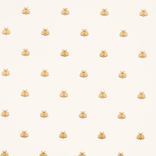 Hubert's Bees wallpaper in white and gold by Schumacher, featuring a small-scale bee motif with gold metallic ink on a white background.