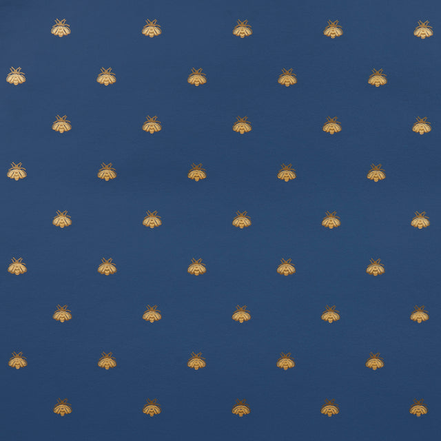 Hubert's Bees wallpaper in Midnight & Gold by Schumacher, featuring a small-scale gold bee motif on a deep blue background.