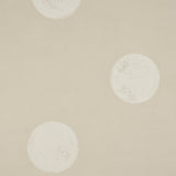 Monte Carlo Light Beige by Backdrop, a wide-width wallpaper with large-scale random polka-dot pattern inspired by stacked dice, shown in a modern entryway.