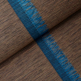 Axel Fringe Wallcovering in Peacock/Brown by Schumacher. Large-scale vertical stripe wallpaper with cut fringe detail, shown in a styled bedroom interior.