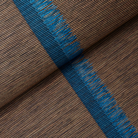 Axel Fringe Wallcovering in Peacock/Brown by Schumacher. Large-scale vertical stripe wallpaper with cut fringe detail, shown in a styled bedroom interior.