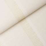 Axel Fringe Wallcovering in Parchment by Schumacher, a large-scale vertical stripe wallpaper with fringe detail and textured finish.