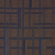 AXEL PLAID WALLCOVERING in Navy/Espresso by Schumacher. Artisanal geometric jacquard weave wallpaper with cut fringe detail, shown in a styled bedroom.