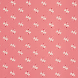 LAVIGNE wallpaper in Rouge by Schumacher, featuring a playful abstract motif on a pink-red background.