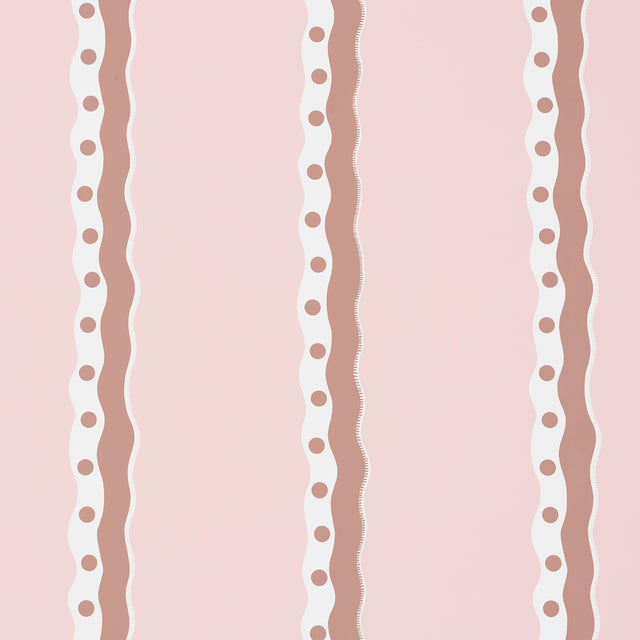 Rousseau Stripe wallpaper in cocoa and blush by Schumacher, featuring wavy vertical stripes with polka dots on a soft pink background.