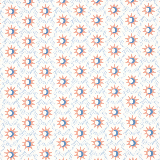 Lucie wallpaper in clay and blue by Schumacher, featuring a celestial starburst and crescent moon pattern.