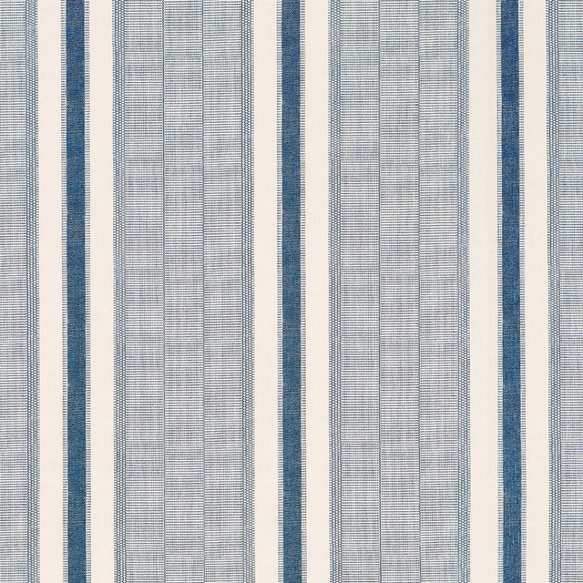 Ipala Stripe Vinyl wallpaper in Ocean by Schumacher, a blue and white multi-width stripe high-performance vinyl wallcovering designed in collaboration with A Rum Fellow.