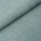 Linen Plissé Wallcovering in Adriatic Blue by Schumacher, shown in detail and installed in a bedroom setting.