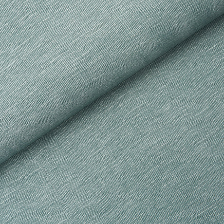 Linen Plissé Wallcovering in Adriatic Blue by Schumacher, shown in detail and installed in a bedroom setting.