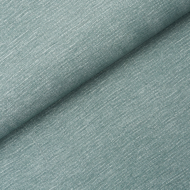 Linen Plissé Wallcovering in Adriatic Blue by Schumacher, shown in detail and installed in a bedroom setting.