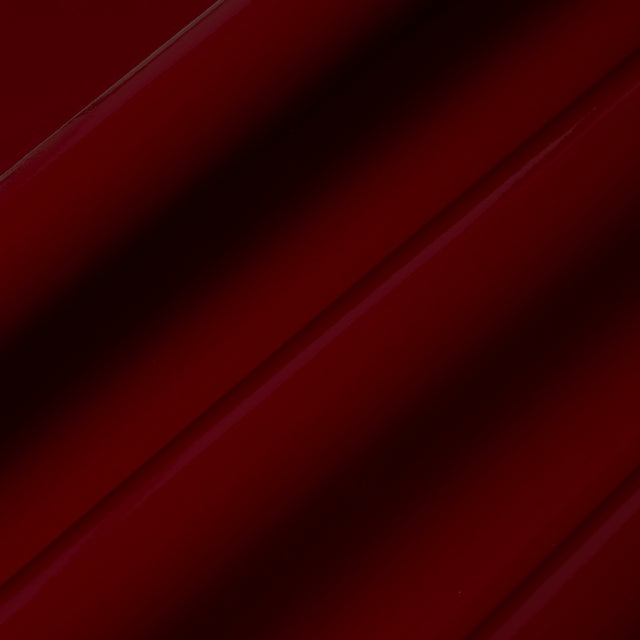ACE FAUX LACQUER PERFORMANCE VINYL in maroon, a glossy, high-performance vinyl wallcovering by Schumacher, shown in a luxurious interior setting.
