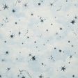 Luminaries wallpaper by Backdrop x Xavier Donnelly for Schumacher, featuring whimsical stars and celestial objects on a soft blue cloudscape background.