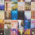 The New Yorker City-View Covers wallpaper by Schumacher featuring a vibrant collage of iconic New Yorker magazine covers in multicolor, celebrating New York City.