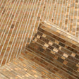 Etti Waterlily Wallcovering in Warm Gold by Schumacher, hand-assembled with waterlily, grass, and metallic paper for a mosaic-like, textural effect.