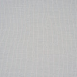 La Voie Wallcovering in Whisper Blue by Schumacher, a jacquard design with organic striping, shown in a modern bedroom setting.