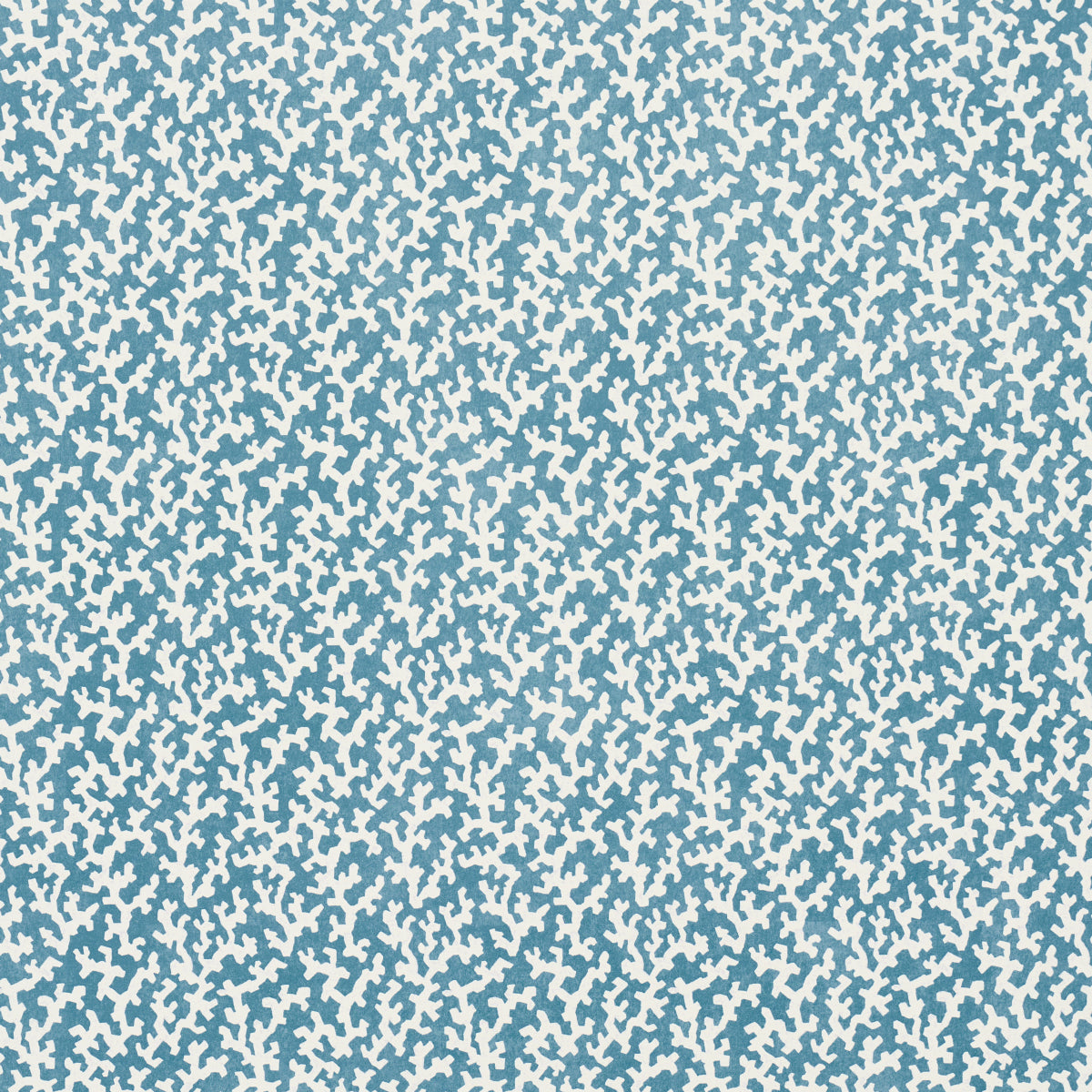 FOLLY Marine by Veere Grenney for Schumacher. Allover coral-like blue and white wallpaper pattern in a bathroom interior.