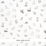 Good Dogs Everywhere peel-and-stick wallpaper featuring black and white cartoon dogs from The New Yorker collection by Schumacher.