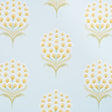 Aurelia Sky wallpaper by Schumacher featuring large stylized yellow and white blossoms on a soft blue background, shown in a bathroom setting.