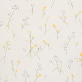 Alex's Floral wallpaper in Daffodil by Schumacher, featuring painterly yellow and white flowers on a light background.