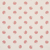 Red tossed-flower pattern wallpaper, Auclair Floral by Schumacher, shown in a styled bathroom setting.