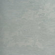 Drifting Cloudscape Mist wallpaper by Schumacher, a large-scale woven wallcovering with a subtle cloud-inspired pattern and metallic shimmer, shown in a serene bedroom setting.