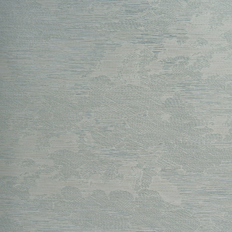 Drifting Cloudscape Mist wallpaper by Schumacher, a large-scale woven wallcovering with a subtle cloud-inspired pattern and metallic shimmer, shown in a serene bedroom setting.
