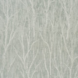 Komorebi Mist by Schumacher - Textured metallic arboreal pattern wallpaper in a serene mist colorway, shown in a modern bedroom setting.