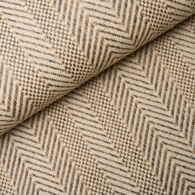Zigzag Paperweave wallpaper in flax colorway, featuring a pronounced herringbone texture and woven pattern, styled in a modern interior setting.