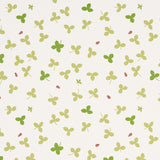 Celia Clover wallpaper by Schumacher featuring a whimsical botanical clover pattern with ladybugs and honeybees on an ivory background.
