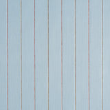 Draper Stripe wallpaper in The Early Stuff colorway by Schumacher, featuring vertical multicolor pinstripes on a textured background.