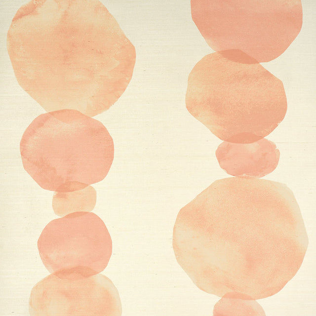 Hyperion Sisal wallpaper in peach by Schumacher, featuring large-scale circular forms in a hand-painted ink wash style on natural sisal texture.