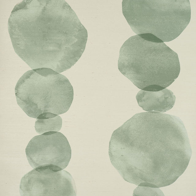 Hyperion Sisal wallpaper in Soft Green by Schumacher, featuring large-scale circular ink wash forms on a natural sisal texture.