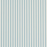 Emma Stripe Narrow wallpaper in Chambray by Schumacher, featuring crisp blue and white vertical stripes, shown in a bathroom setting.